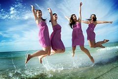 Toronto Wedding Photography - Bridesmaids jumping in ocean