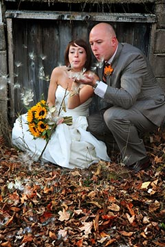 Nature Wedding Photography - Bride and Groom blowing wishes in the Fall