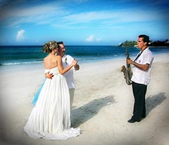 Destination Wedding Photo - Dancing on the beach with saxophone